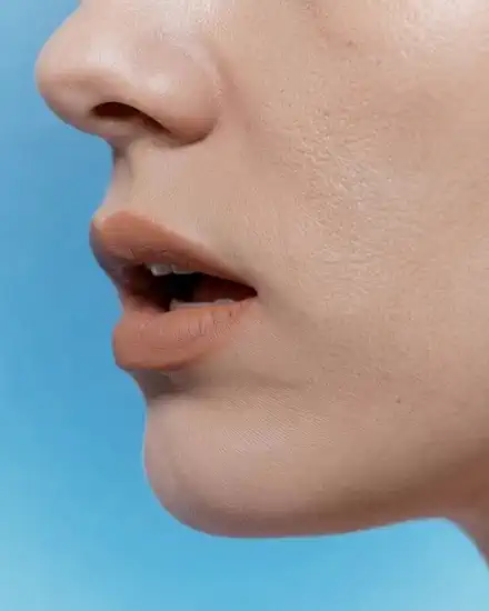 A mouth speaking, in profile